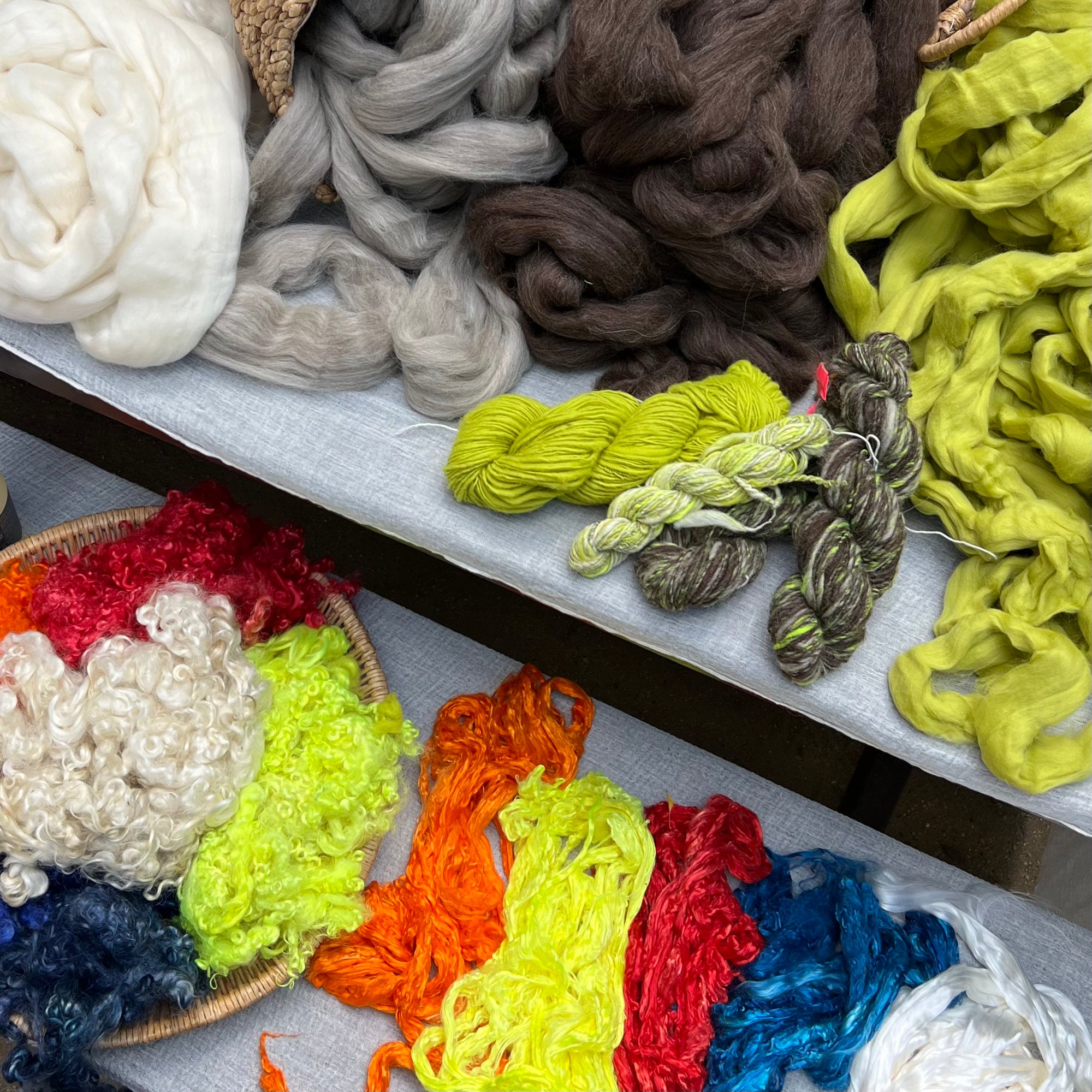 Assorted colorful yarns on a shelf
